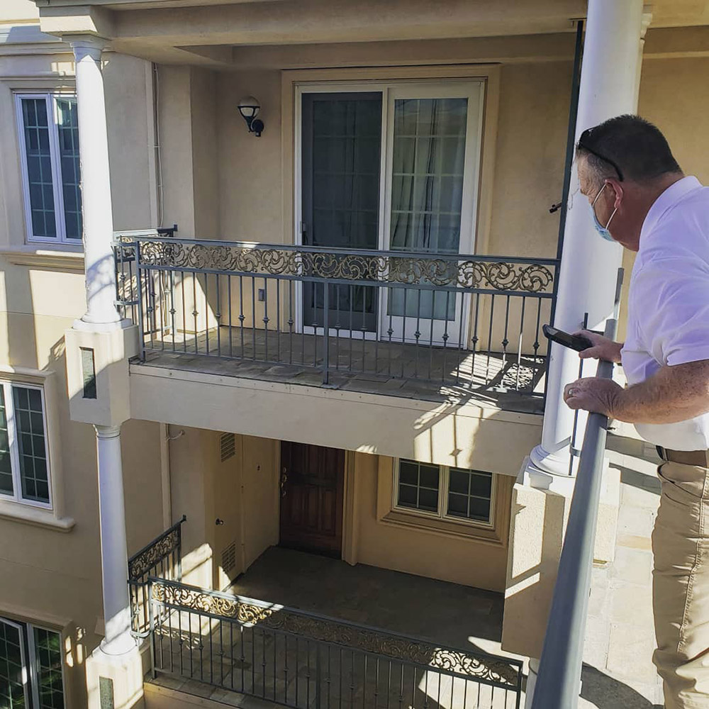 PIW inspector looking at balconies on a site walk for SB326 inspections