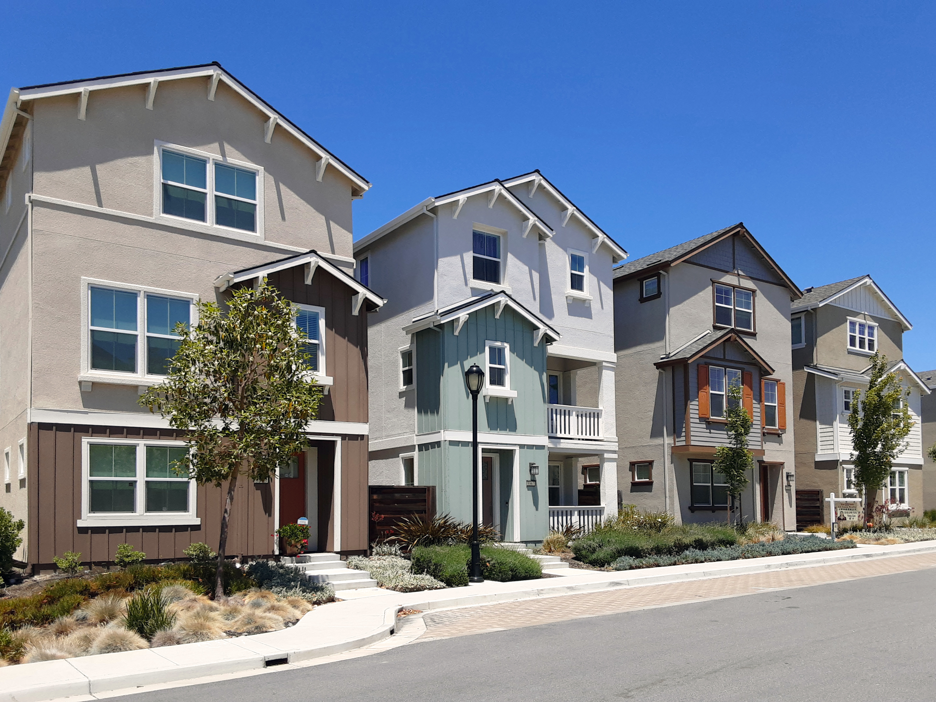 row of completed new construction residential buildings