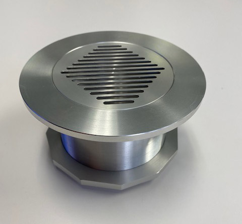 closeup of puck style vent for closed soffit exterior elevated elements